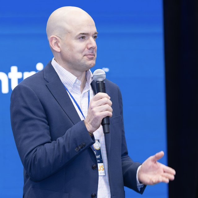 Dan speaking at a conference